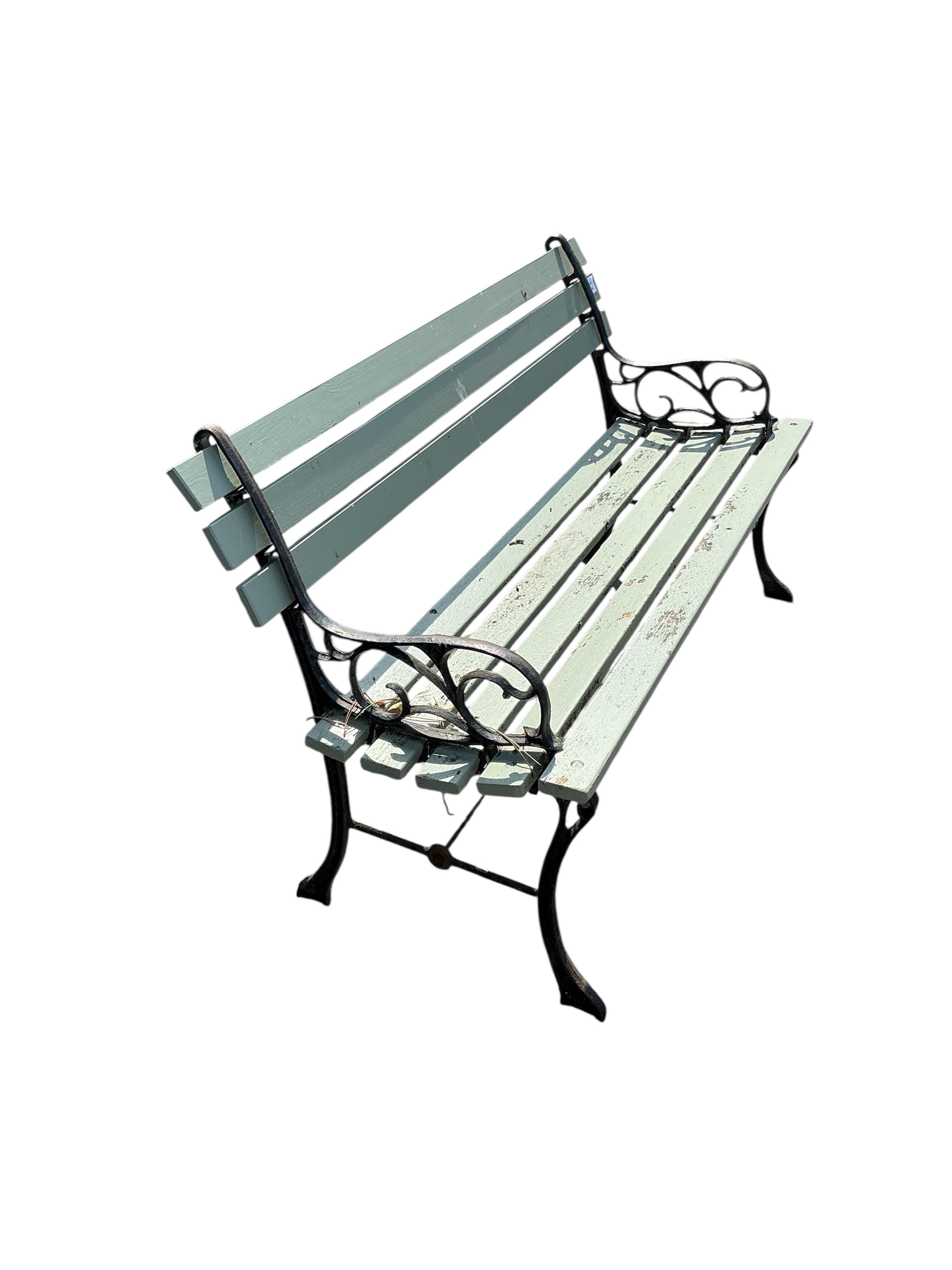 A cast metal slatted wood garden bench, width 122cm, depth 48cm, height 68cm